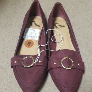 Burgundy suede flats.
